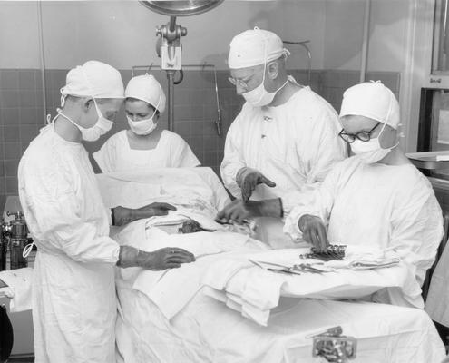 Hospitals and Medical; Doctors and nurses performing surgery