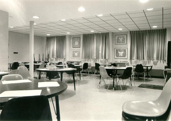 Interiors of Rooms; A meeting room with several round tables