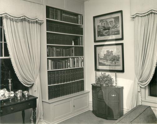 Interiors of Rooms; Bookshelves and paintings of horses