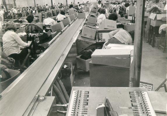 Irvin Industries; Several people working on an assembly line