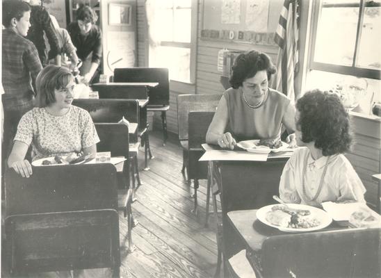 Johnson, Lyndon B. and Ladybird; Ladybird Johnson eating lunch with school children, 1964