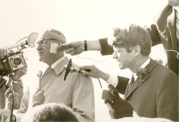 Kennedy, Robert; Robert Kennedy at a press conference (with Henry Kissinger)