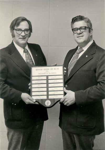 Kentucky Central Life Insurance Company; Two men pose with the Salesman of the Month Award