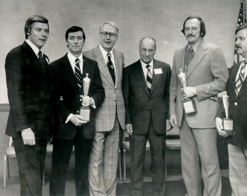 Kentucky Central Life Insurance Company; Six employees holding trophies