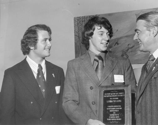 Kentucky Easter Seal Society; The Easter Seal Society presents a plaque to Lambda Chi Alpha