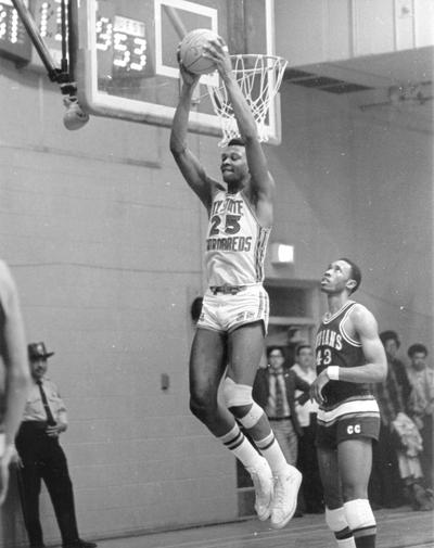 Kentucky State University; Basketball; #25 goes up for a reverse two handed dunk