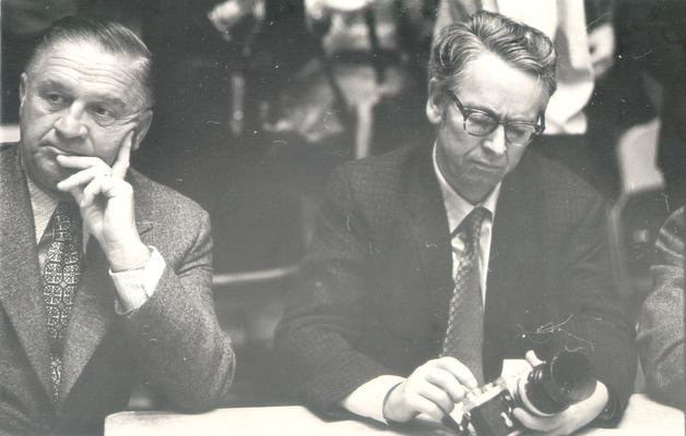 Lancaster, Harry; Harry Lancaster sitting next to a photographer