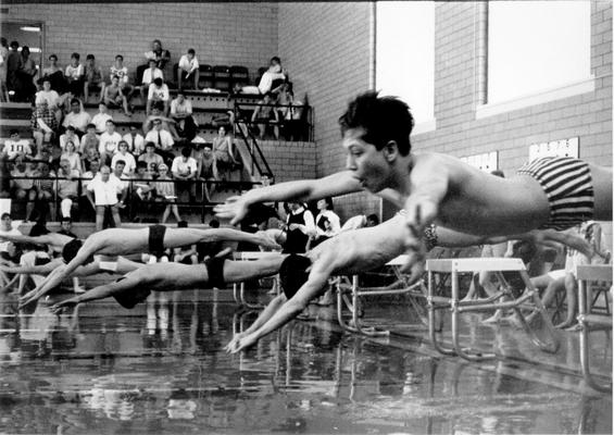 Athletics; Swimmers dive off the starting platform