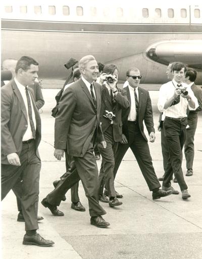 McCarthy, Eugene; The press takes pictures as McCarthy exits his plane