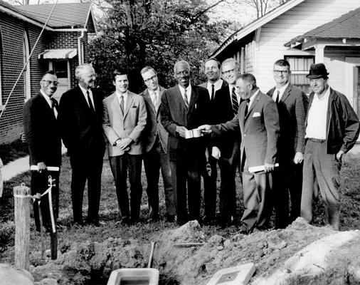 Men; Groups; Unidentified; Men of different races pose together for a photo