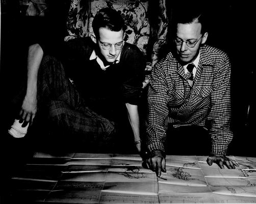 Men; Individual; Unidentified; Two men looking at a map