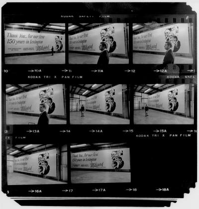 Milward Funeral Home; Contact Sheets; Negatives of Milward standing in front of his billboard