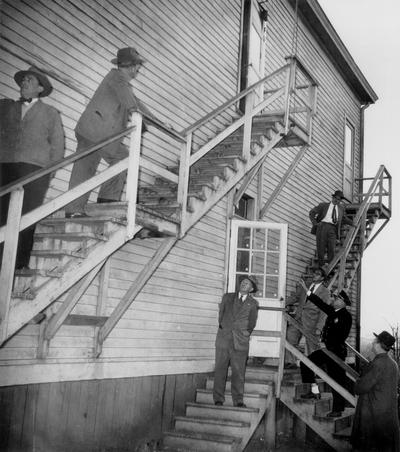 News Photographs; Police detectives check out a crime scene