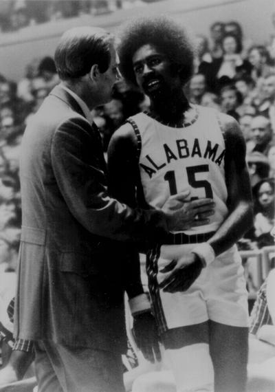 Newton, C. M.; Newton talking things over with a basketball player from Alabama