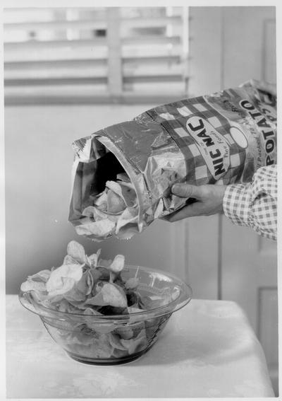 Nic Nac Potato Chips; Advertising Photos; Chips being pored into a glass bowl