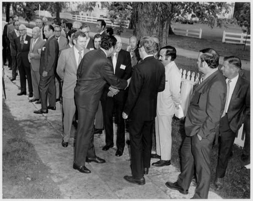 Nunn, Louie B.; Nunn shakes hands with a group of admirers