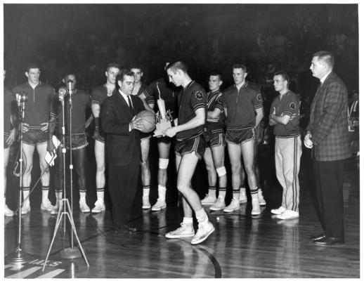 Transylvania University; Basketball; Representative from the Ohio State University receives trophy