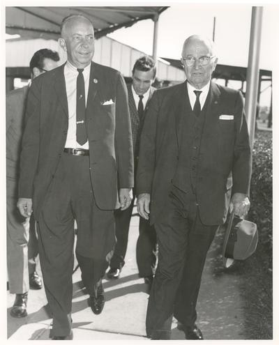 Truman, Harry S.; Truman holding his hat