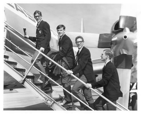 University of Kentucky; Basketball; Four young men are boarding an aeroplane