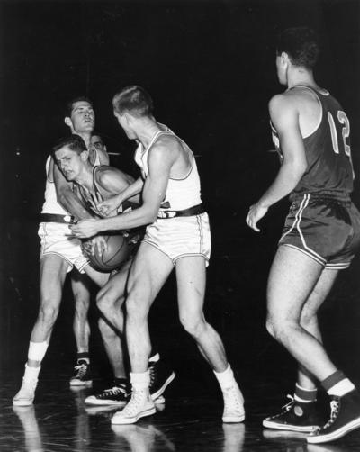 University of Kentucky; Basketball; UK vs. [Unknown]; Two Kentucky players strip an opponent