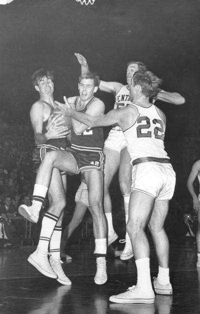 University of Kentucky; Basketball; UK vs. [Unknown]; Opponent #42 claims a hard-fought rebound