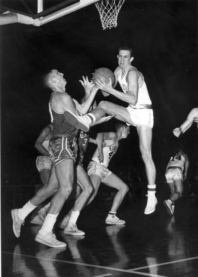 University of Kentucky; Basketball; UK vs. [Unknown]; A Kentucky player accidentally kicks an opponent