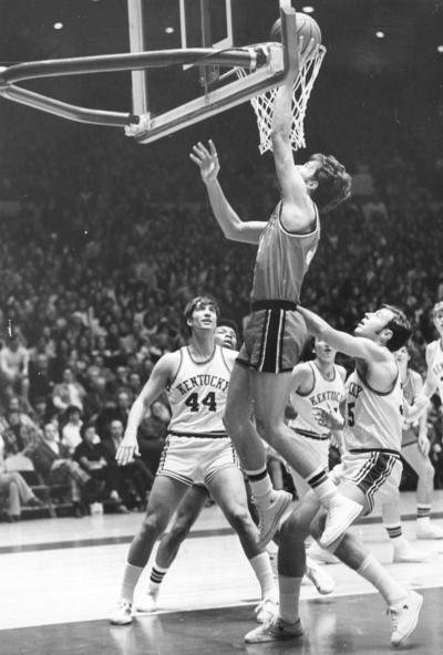 University of Kentucky; Basketball; UK vs. [Unknown]; An opponent drives past 4 Kentucky defenders