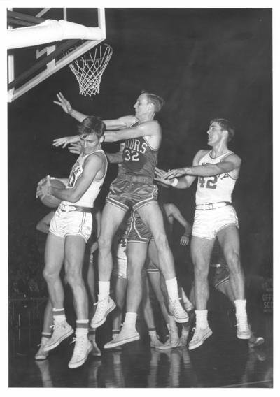 University of Kentucky; Basketball; UK vs. Florida; Three players jump for an above-the-rim rebound