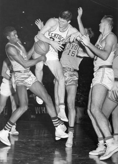 University of Kentucky; Basketball; UK vs. Loyola; Several players get tangled up chasing after the ball