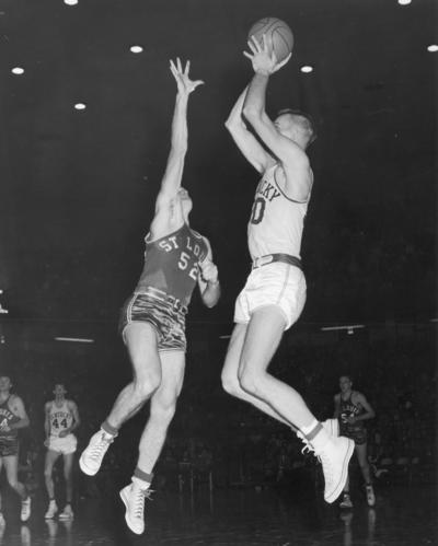 University of Kentucky; Basketball; UK vs. St. Louis; An airborne Kentucky player shoots a jump shot