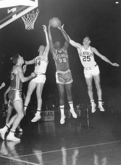 University of Kentucky; Basketball; UK vs. St. Louis; St. Louis #32 out jumps two Kentucky players to claim the rebound