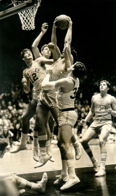 University of Kentucky; Basketball; UK vs. Tennessee (Volunteers); Three Kentucky players combine to block a shot by Tennessee