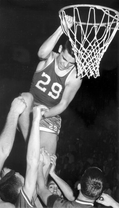 University of Kentucky; Basketball; UK vs. UK Invitational Tournament; Player #29 hangs on the rim; others grab at him from underneath