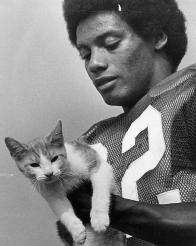 University of Kentucky; Football; Individual Players; Football player #2, holding a cat