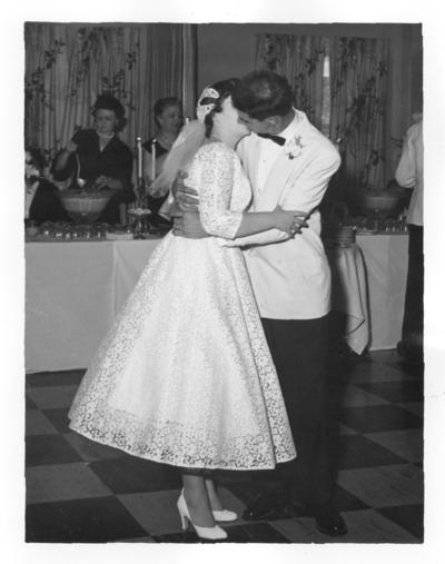 Wedding; Bride and groom kissing