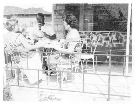 Family and Friends; A man and the women sitting outdoor