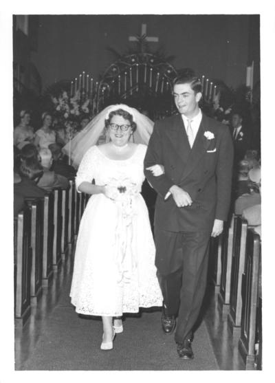 Family and Friends; Two people walk down the aisle