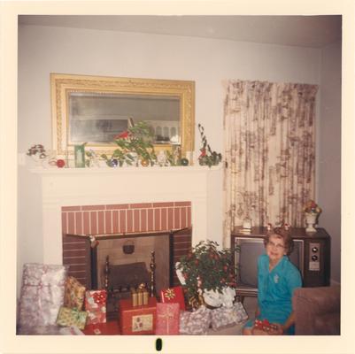 Personal Photos; A woman by a fire place