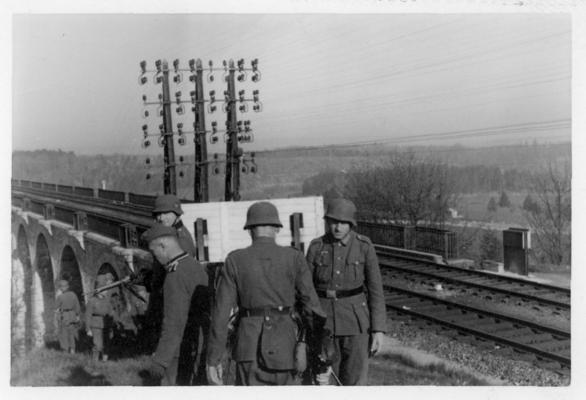 Postcard; Soldiers by the railroad