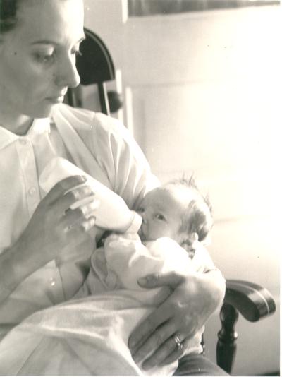 Babies; Mother feeds child with bottle