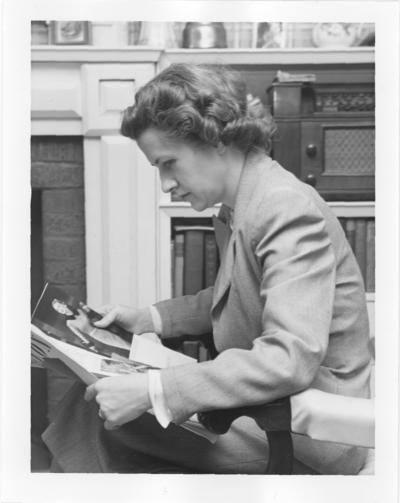 Marjorie; Marjorie looking at photographs