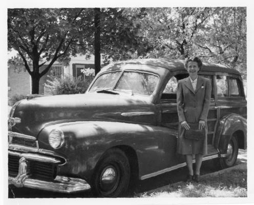 Marjorie; Marjorie beside her car