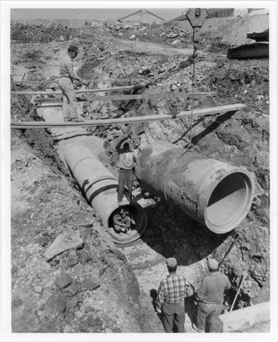 West Hickman Creek Interceptor Sewers; Construction; Five men working on the pipes