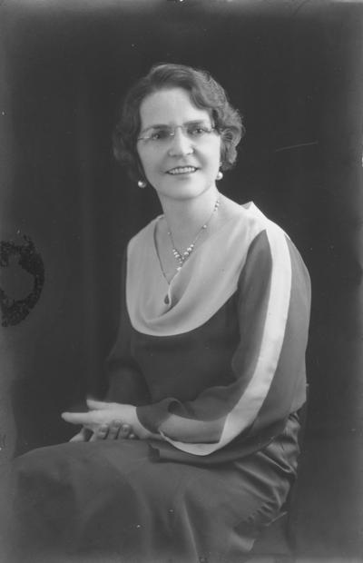 Women; Individual; Unidentified; A woman wearing glasses