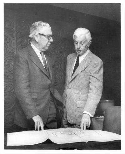 Young, William T., Jr.; William T. Young discussing a blue-print