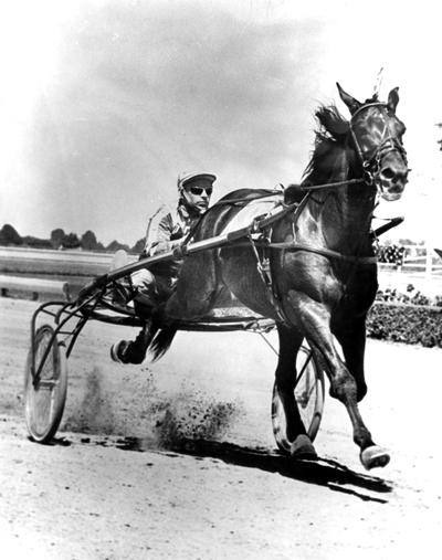 Dancer, Stanley; Stanley Dancer riding a horse