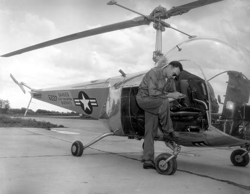 Planes, Helicopters, and Parachutists; A helicopter and its pilot