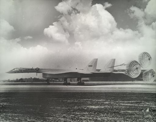 Planes; US Air Force plane slowing itself down through the use of parachutes