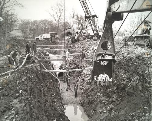 West Hickman Creek; Sewer Construction; Workers helping to lay the foundation for a sewer system