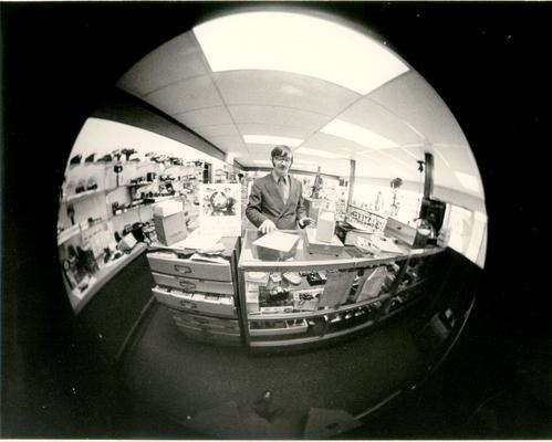 Buildings; Unidentified; Fisheye lens photograph of a camera store [MISSING]